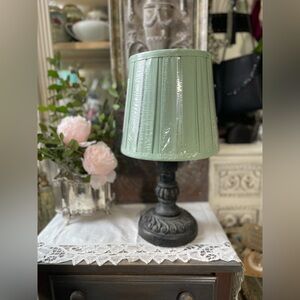 Lampshade made of fabric in a beautiful spring green color.